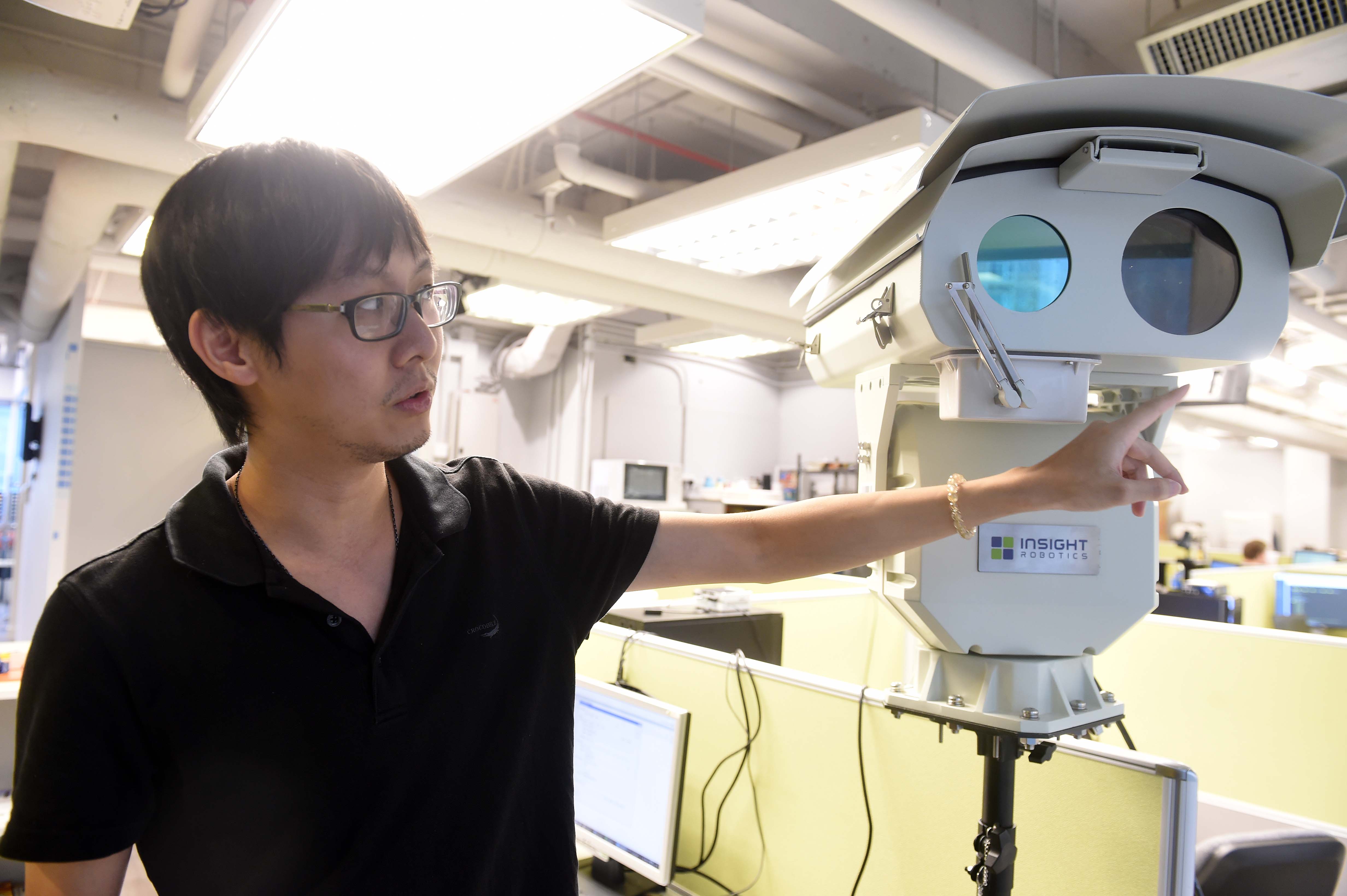 Co-founder Rex Sham with his Wildfire Detection Robot